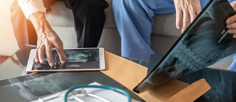 doctor reviewing orthopedic charts