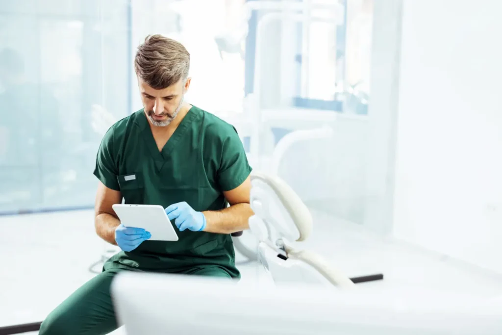 Dentist reviewing tablet