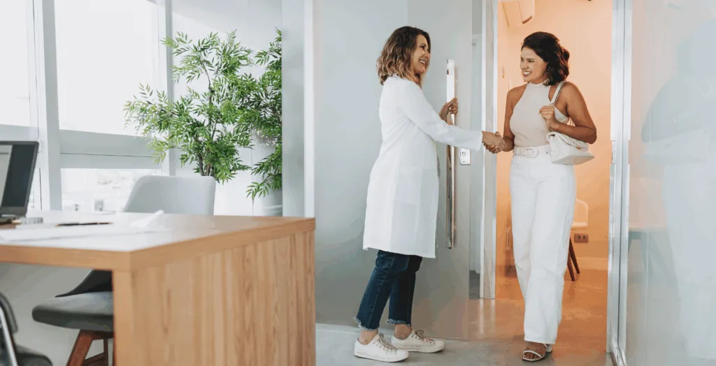 Dental office manager greeting patient