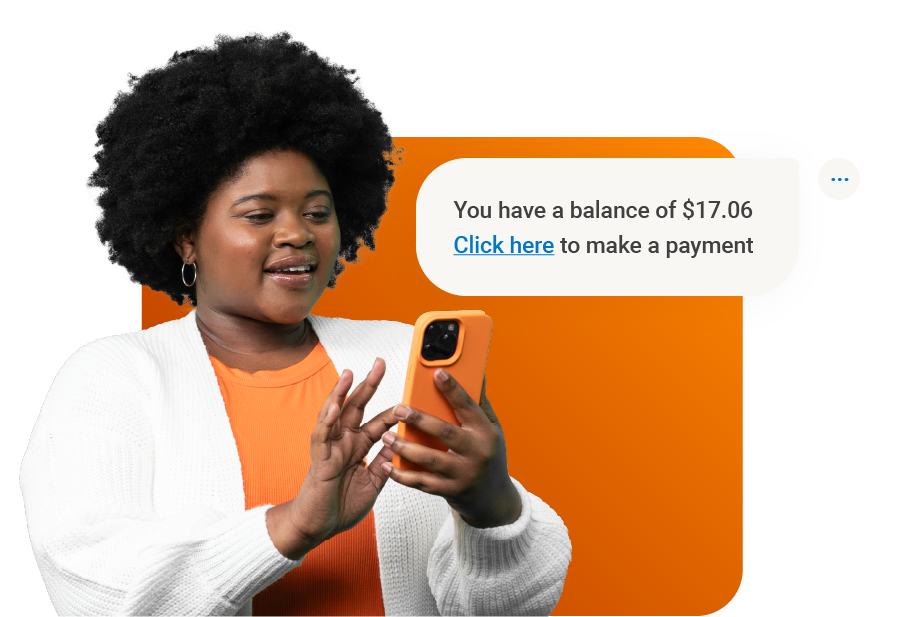 A photo of a woman using her mobile phone to make a payment.