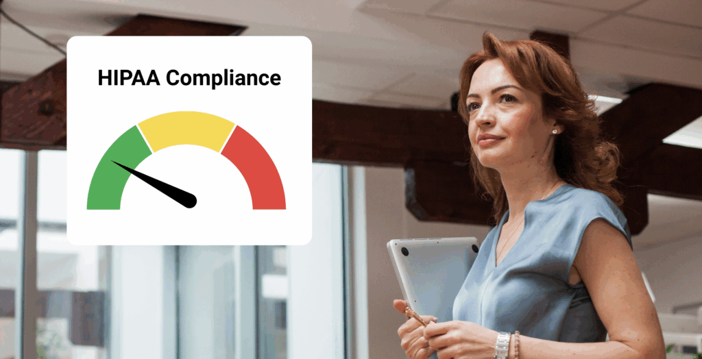 A female office manager holding a computre looks ahead confidently.